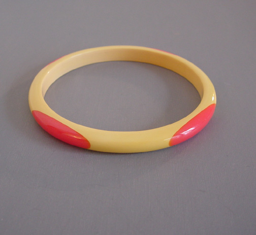 SHULTZ bakelite cream spacer bangle with pink marbled dots