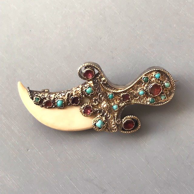 AUSTRO-HUNGARIAN antique saber or sword brooch with turquoise and garnets and an animal claw