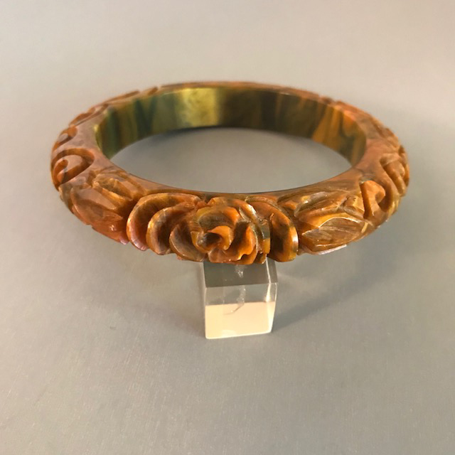 BAKELITE bangle, deeply carved end-of-day swamp green with lots of peach and black marbling