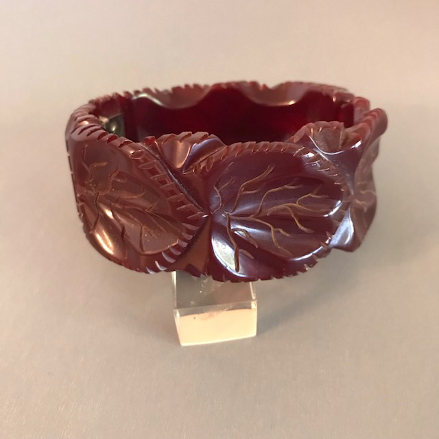 BAKELITE translucent wine reddish brown hinged clamper bangle with leaf carving