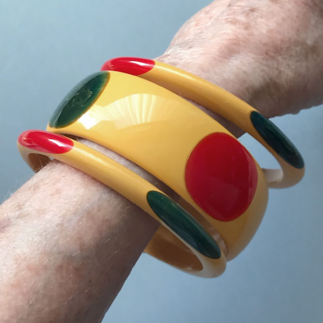 SHULTZ set of three bakelite bangles in opaque butterscotch, each with two blue dots and two red dots
