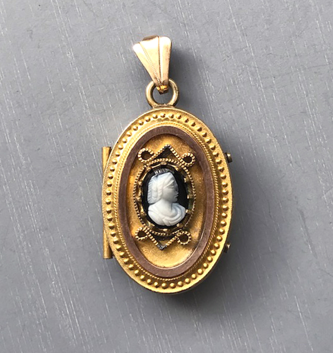 VICTORIAN revival yellow gold filled locket with a black and white cameo on the front