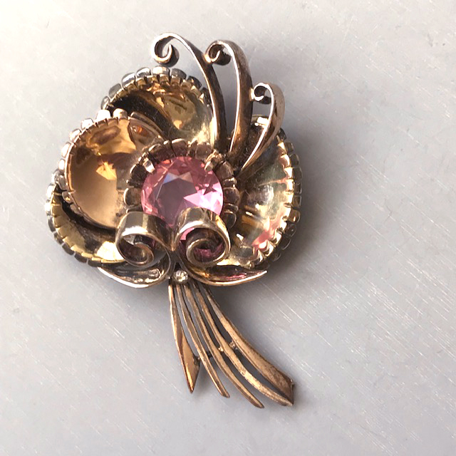 DEROSA gold washed sterling brooch with a lovely pink rhinestone center