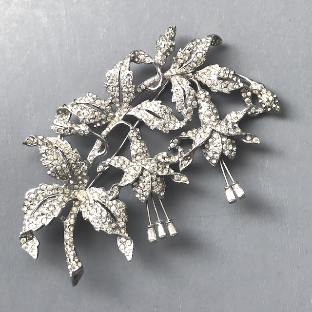 STARET fuchsia flower brooch of clear rhinestone pave set in silver tone