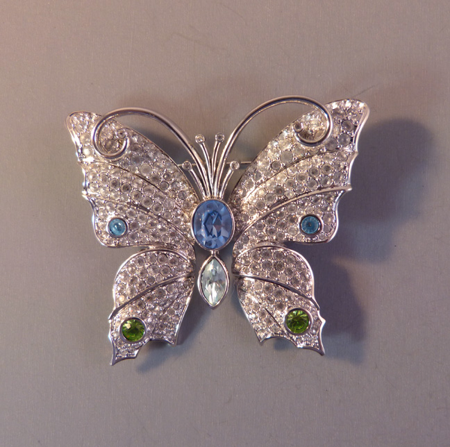 SWAROVSKI Signature Jewelry 2004 butterfly brooch with clear rhinestone paved wings, pastel blue and green dots
