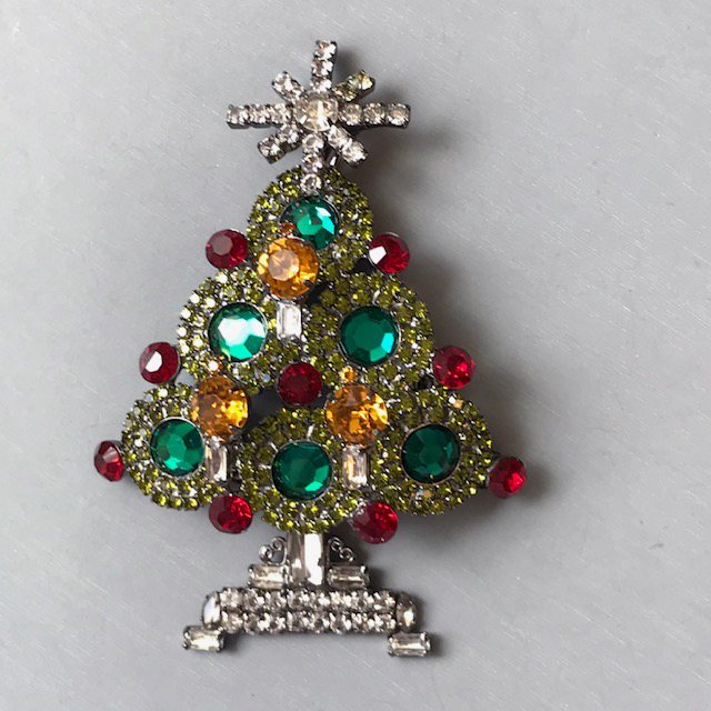 LARRY VRBA Christmas tree brooch with emerald green ornaments, red rhinestone “lights” a lighter green rhinestone boughs and clear and topaz colored candles