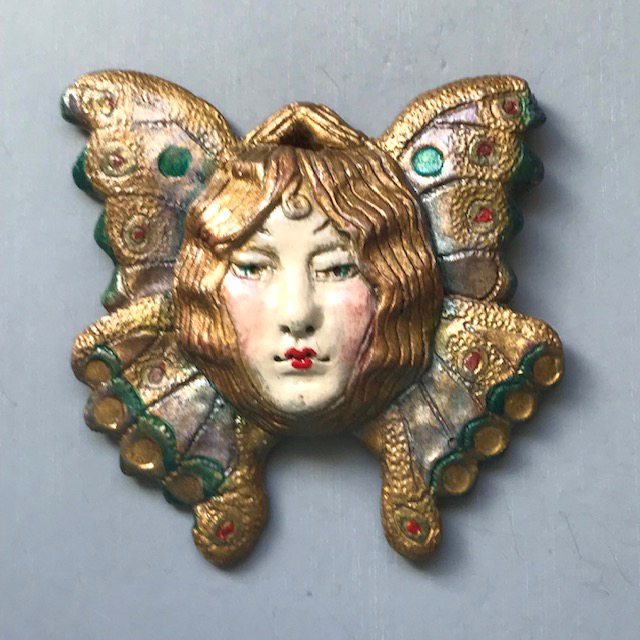 DENICOLA painted angel face ornament that is signed by hand and dated 1990