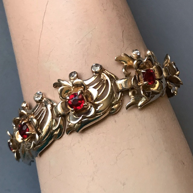 DEROSA flowers in the wind design bracelet with red rhinestones in gold plated sterling