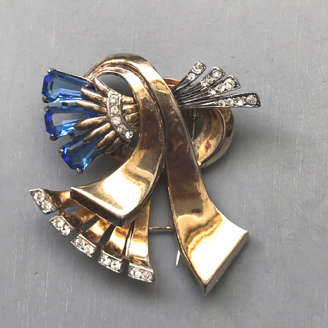 DEROSA Retro fur clip with blue kite shaped unfoiled rhinestones along with clear rhinestones in a gold plated sterling silver setting