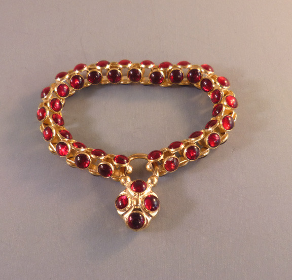 RED heart padlock bracelet of transparent glass cabochons set in gold tone with a padlock closure to match