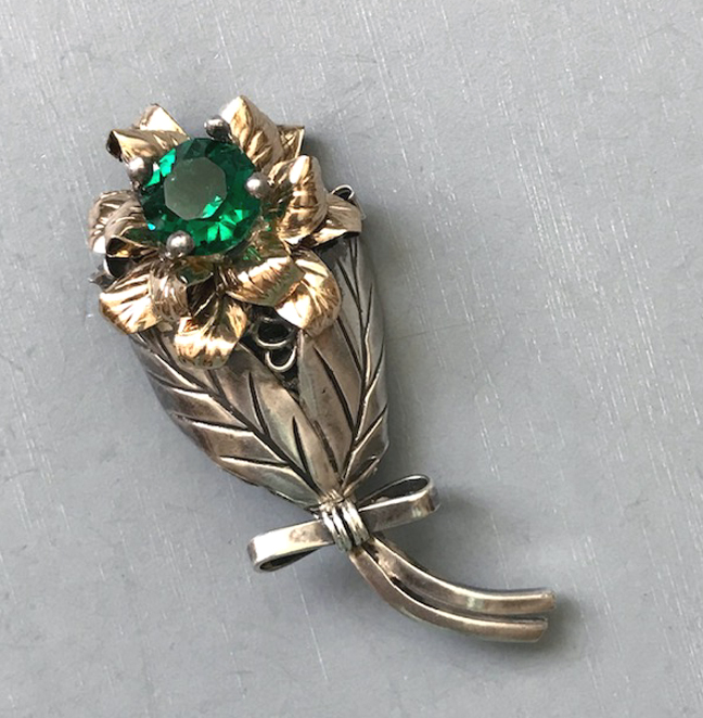 HOBE flower brooch with a gleaming green rhinestone, sterling silver and gold plated sterling flower bouquet tied with a bow at the bottom