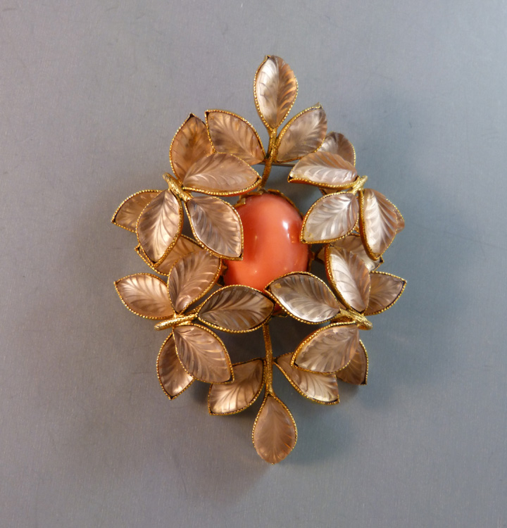 SCHREINER brooch of lustrous peach colored pressed glass leaves and an oval orange glass cabochon center in a gold plated setting with a pendant hook on back