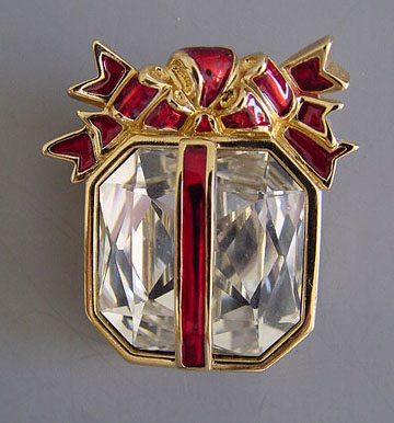 SWAROVSKI Savvy Christmas package brooch with a large center crystal and red enameled ribbons