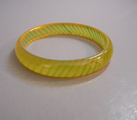 SHULTZ bakelite rare transparent yellow spacer bangle with reverse carved and painted green slashes