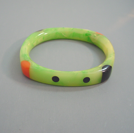 SHULTZ bakelite round cornered square bangle in marbled green with orange, cream and black and dots