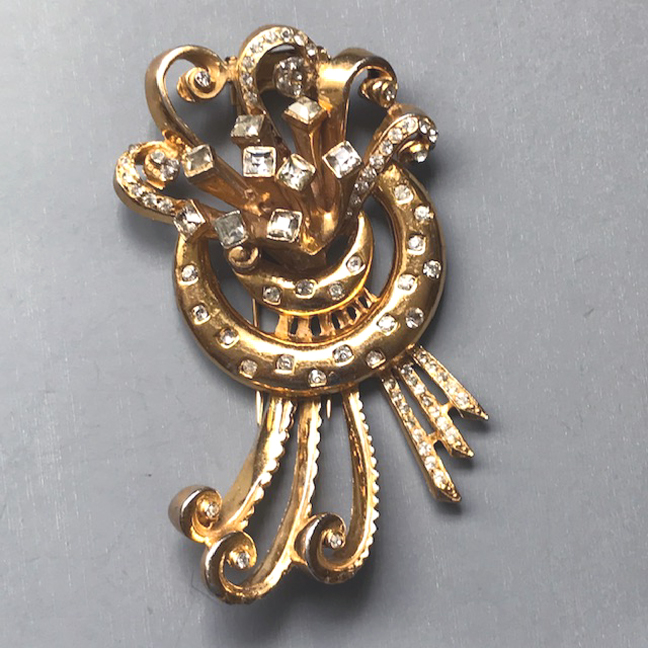 DEROSA unsigned fur clip with bright clear rhinestones in a gold plated setting, all in a DeRosa style design