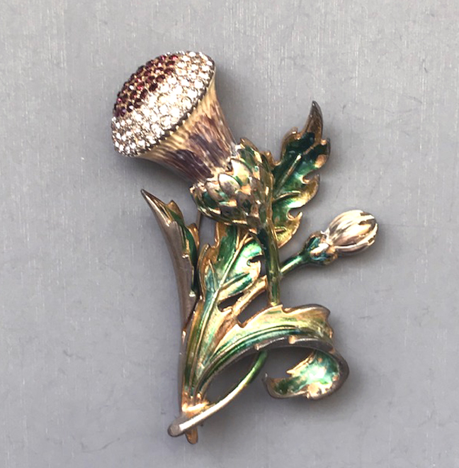 DEROSA unsigned enameled thistle brooch with translucent green leaves and clear and purple rhinestones