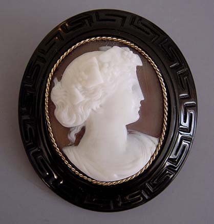 VICTORIAN antique hand carved Whitby jet and and sea shell cameo brooch with a Greek key design around the edge