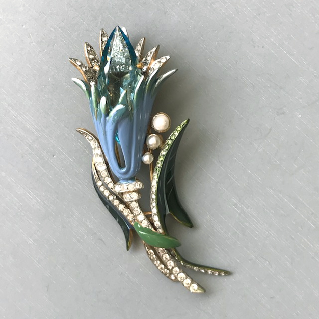 DEROSA flower fur clip with a long pointed aqua blue rhinestone center, a vintage clip with professionally enameled blue flower and green leaves