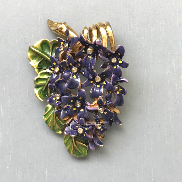 DEROSA fur clip of beautifully enameled purple violets with yellow centers, translucent green leaves and clear rhinestones