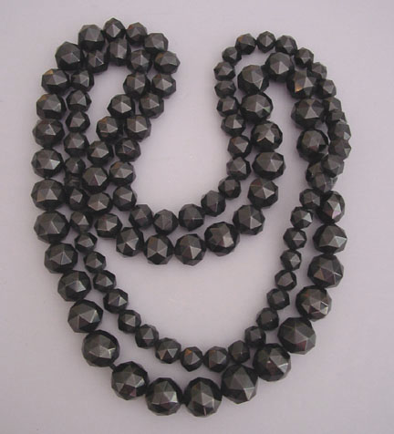 antique Whitby jet faceted beads, 56″ long with beads that graduate from 3/4″ down to 1/3″, all hand carved