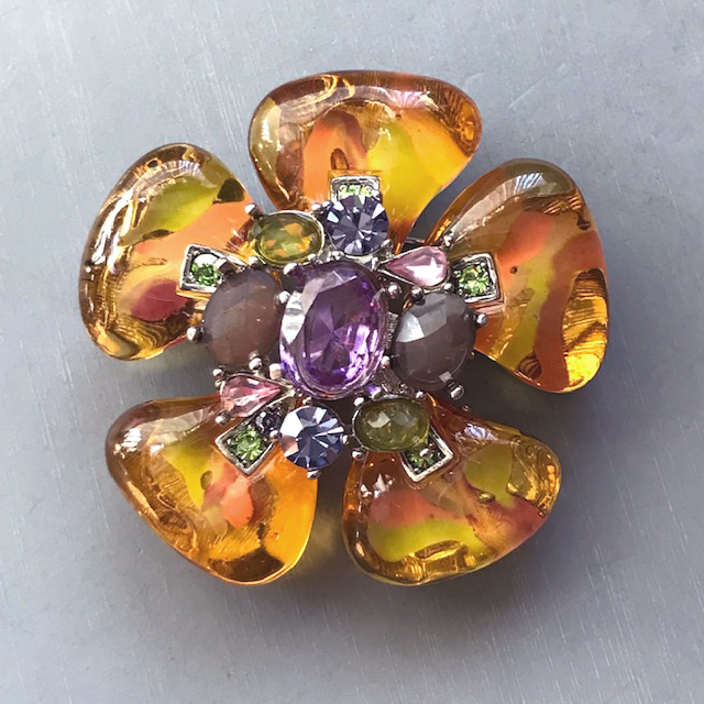 FLOWER brooch with honey colored poured glass or resin petals and purple, lavender, pink and green rhinestones