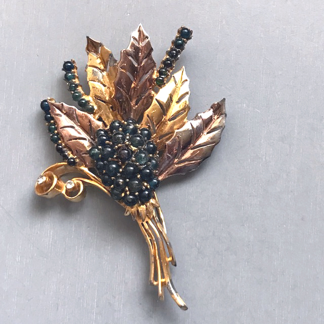 DEROSA flower bouquet fur clip with dark blue glass cabochons set in yellow and rose gold plated metal and signed “R DeRosa”