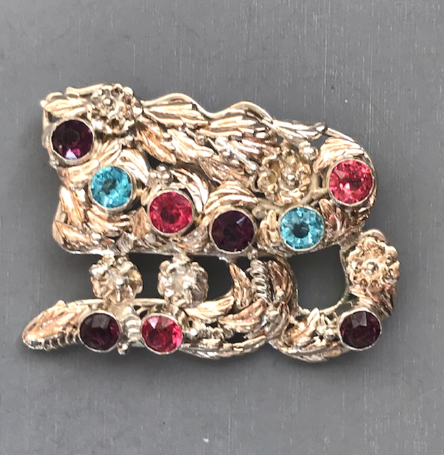 HOBE sterling silver and colorful rhinestones brooch with pink, purple and pastel blue rhinestones in a hand wrought sterling silver setting of flowers, leaves and scrolls