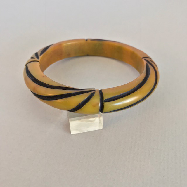 BAKELITE over dyed butterscotch with lime green marbling and black resin washed line carved bangle