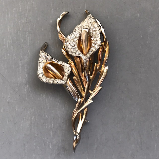 DEJA Jack-in-the-Pulpit gold plated brooch with clear rhinestones, signed “Deja” on the back
