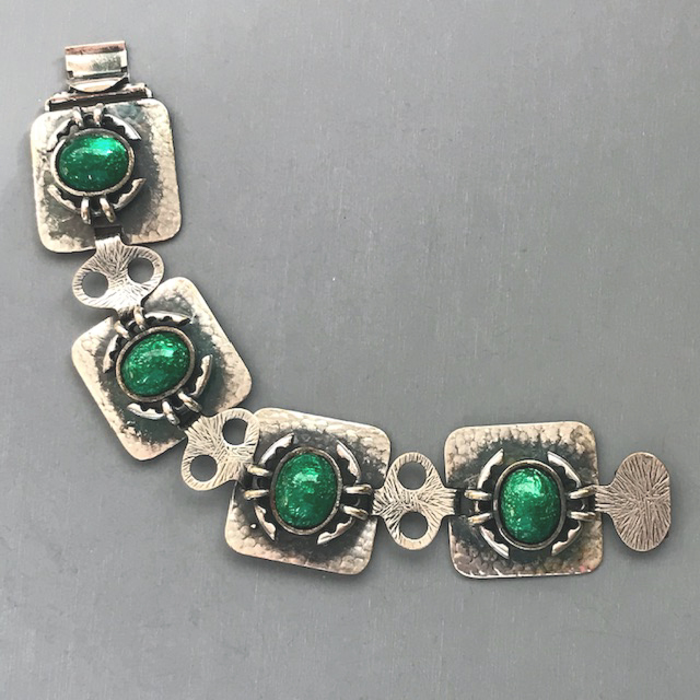 ARTS and CRAFTS style rare hammered sterling silver bracelet with green enamel centers and etched designs on the links