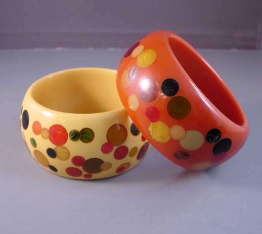 SHULTZ set of TWO chunky bakelite bangles, early Shultz pieces in butterscotch and orange, each with colorful confetti dots