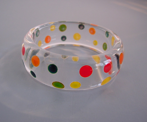 SHULTZ Lucite clear bangle with inset confetti dots in red, green, yellow, blue moon and orange