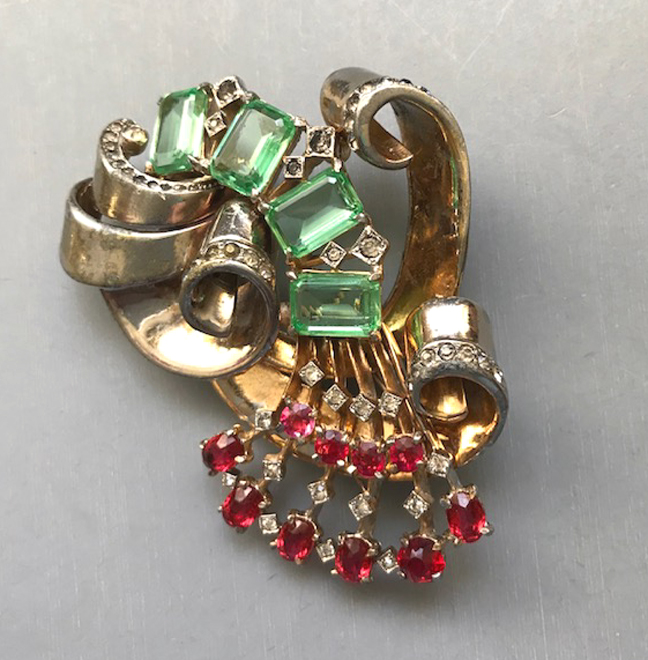 DEROSA fur clip with four lovely pastel green emerald cut unfoiled rhinestones with a spray of red and clear rhinestones below