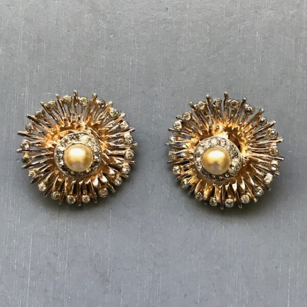 DEROSA sunburst clip back earrings with glass pearl centers edged with clear rhinestones in gold plated sterling silver settings