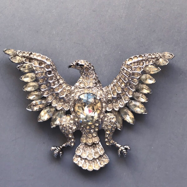 EISENBERG large eagle brooch with brilliant clear rhinestones in a silver tone setting, 1951