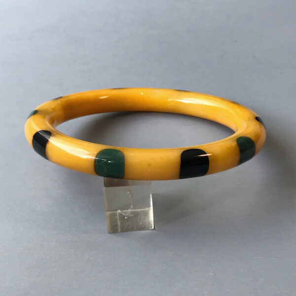 SHULTZ bakelite yellow swirl spacer bangle with 10 black and dark denim blue colored dots