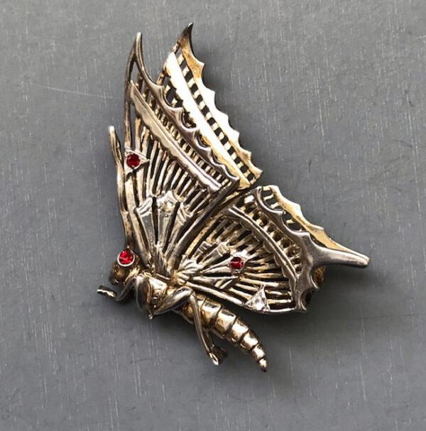 DEROSA gold plated sterling silver butterfly brooch with clear and red rhinestones made in about 1948