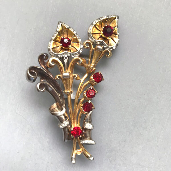 BOUQUET brooch of interesting flowers with red and clear rhinestones in a gold and silver tone setting, a nice size at 4"
