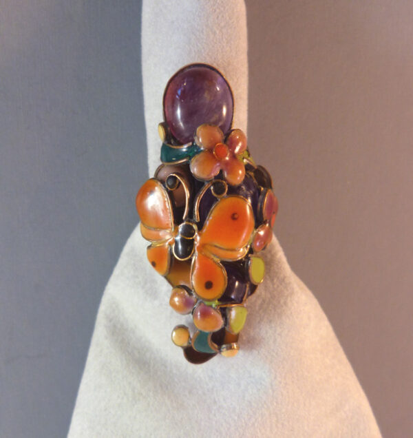 VEGA MADDUX ring with lovely butterfly, flowers and leaves and a purple smooth stone surrounded by lovely enamel work