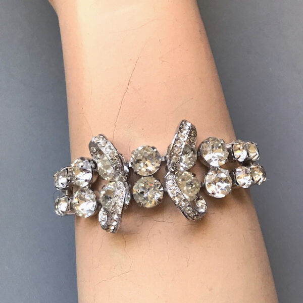EISENBERG bow bracelet with dazzling clear rhinestones in a silver colored rhodium plated setting