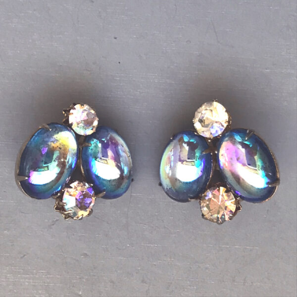 VENDOME satin blue glass cabochon and rhinestones clip back earrings, 1957 ad shown