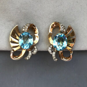 DEROSA attributed aqua unfoiled rhinestone earrings with clear rhinestone accents in a gold tone setting, patented