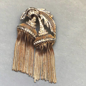 DEROSA rare signed fur clip with gold tone chain fringe and clear rhinestones suspended from a pair of blossom shapes with a leaf on top