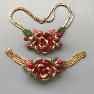 TRIFARI flower necklace and bracelet with enameled red and gold tone cupped flower petals, enameled green leaves and red glass beads, 1941
