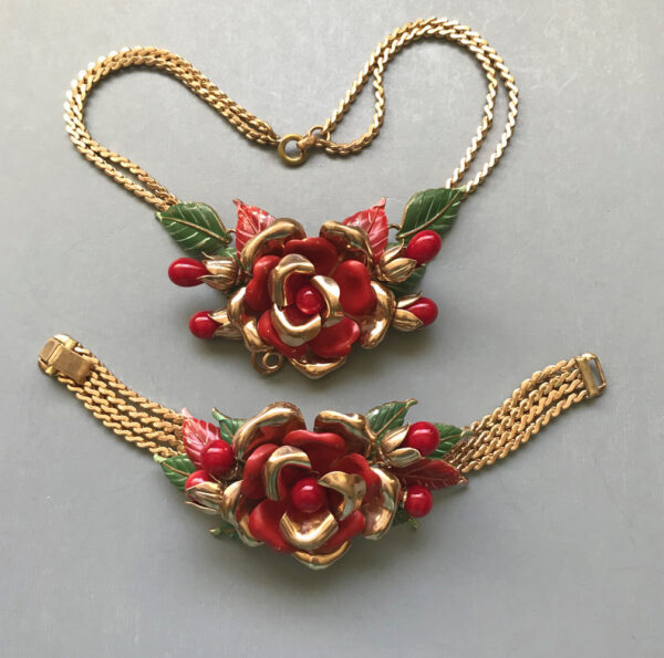 TRIFARI flower necklace and bracelet with enameled red and gold tone cupped flower petals, enameled green leaves and red glass beads, 1941