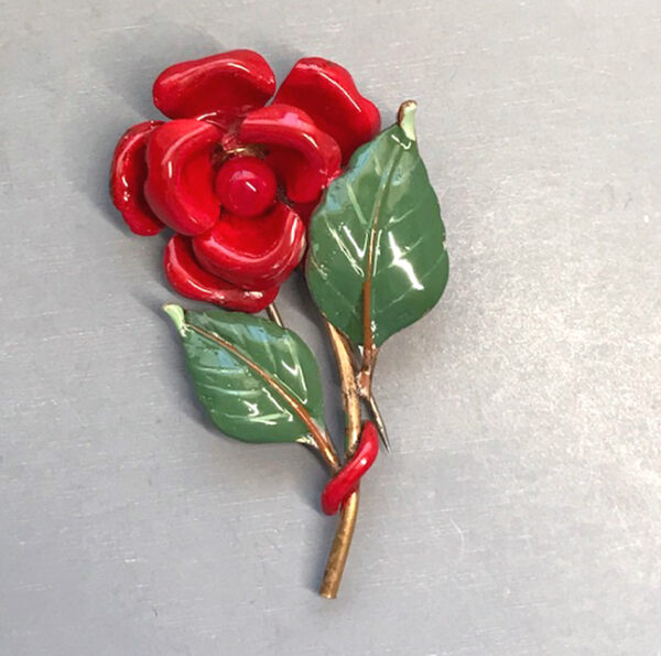 TRIFARI fur clip with red enameled flowers and green leaves, 1941