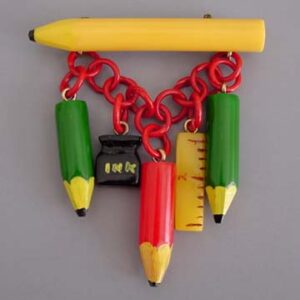 SHULTZ bakelite school days brooch, carved and painted charms, 2001