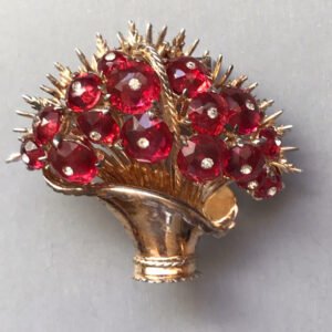 DEROSA spectacular basket of flowers fur clip with transparent red faceted glass lozenges centered with clear rhinestones and set in gold plated sterling silver, 1941