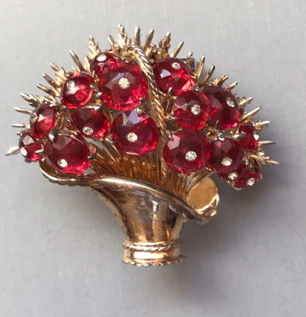 DEROSA spectacular basket of flowers fur clip with transparent red faceted glass lozenges centered with clear rhinestones and set in gold plated sterling silver, 1941